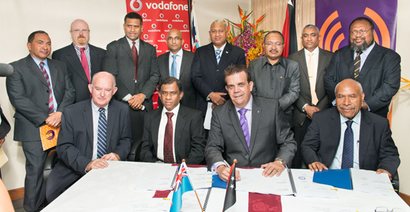 Signing the deal. Back row (from left): Acting MD Michael Ahkoy, Company Secretary Chris Allen, Aisake Taito (FNPF), Pradeep Lal (Vodafone), Fiji PM Frank Bainimarama, PNG PM Peter O'Neill, Wasantha Kumarasiri (IPBC), Public Enterprises Minister Ben Micah Front row: Incoming Chairman Andrew Johnson, FNPF Chair Ajith Kodagoda, outgoing Chairman Syd Yates, IPBC Chairman Thomas Webster