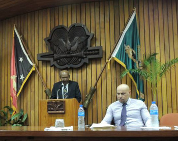 Deputy Prime Minister Leo Dion speakers, flanked by National Planning Minister Charles Abel (right).