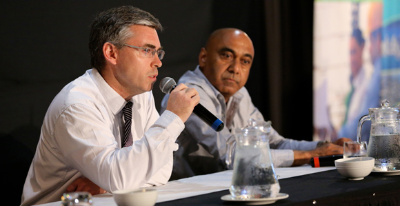 Digicel PNG's John Mangos (left) with Telikom PNG Chairman Mahesh Patel.