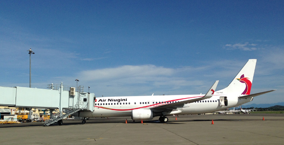 An Air Niugini plane arrives at Port Moresby's Jacksons International Airport