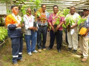 PNGCCIL's Dr. Eremas Tade (3rd from right), and Ramu NiCo's Wang Baowen (left), at the  launch of the cocoa seedlings in Basamuk.
