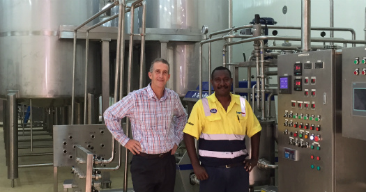 Laga Industries General Manager Gerard O'Brien and Engineering Manager Jeremiah Jerewai review new machinery as part of Gala's new ice cream facilities. Credit: Laga Industries.