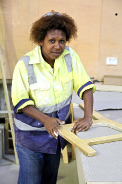 A carpenter at PNG Forest Products in Bulolo. Credit: Ian Neubauer