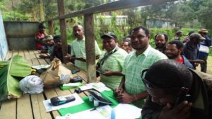 Coffee farmers sign up for their first bank account. Credit: The Loop 