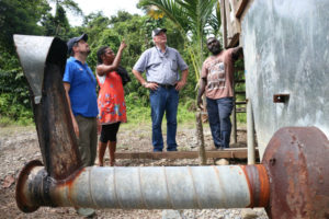 Ishmael Toroama (r) showing one of the fermentaries that he will be rehabilitating. Credit: Australian High Commission