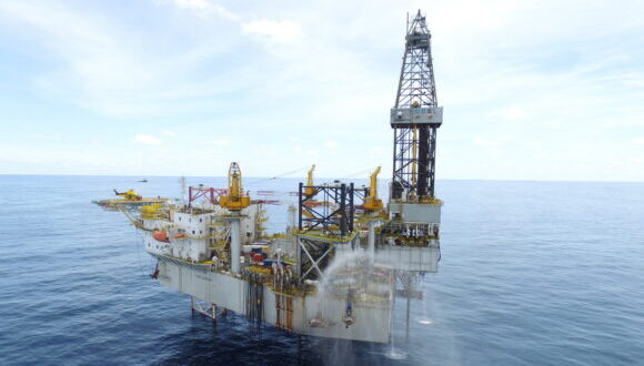 The Pasca A offshore oil rig sits out in the bay.